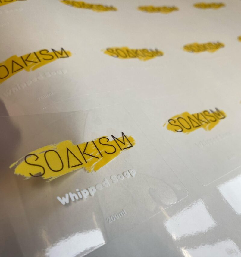 White ink print and a white underbase layer, on clear gloss vinyl. Have a look at our artwork